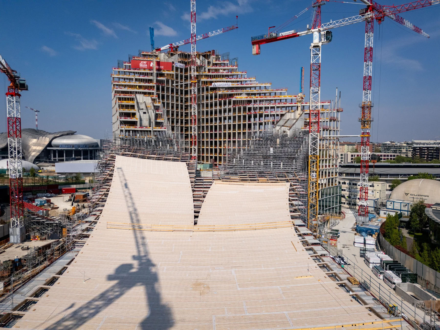 CityWave under construction, with its timber canopy curving up towards the upper floors of an office building.