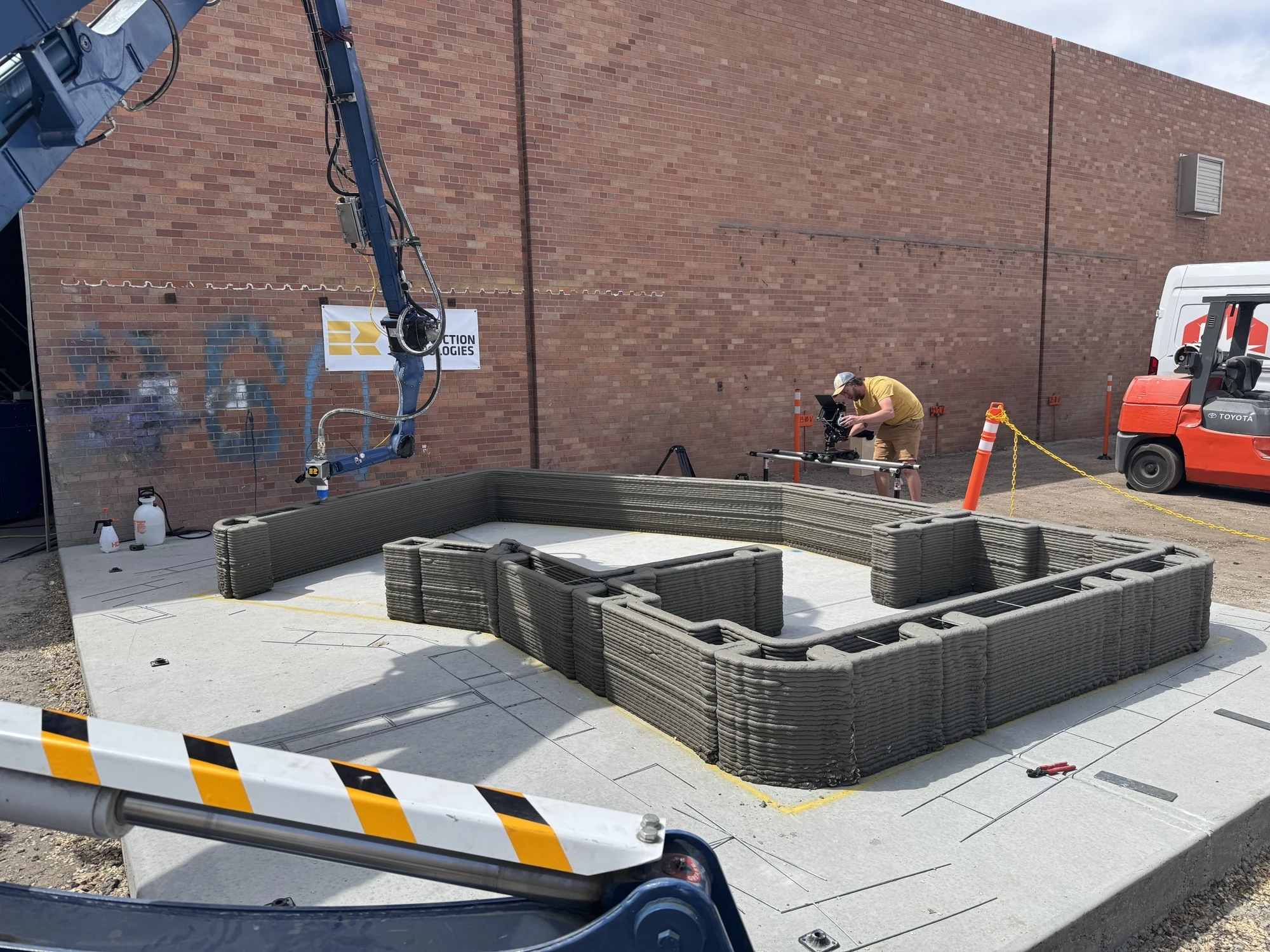 RCT robot printing concrete walls during an early test.